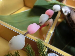 red and white mochi in osechi